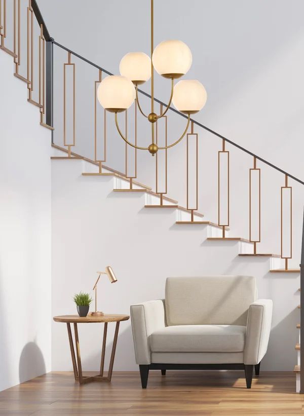 a living room with a couch, table and stairs in the background on a wooden floor