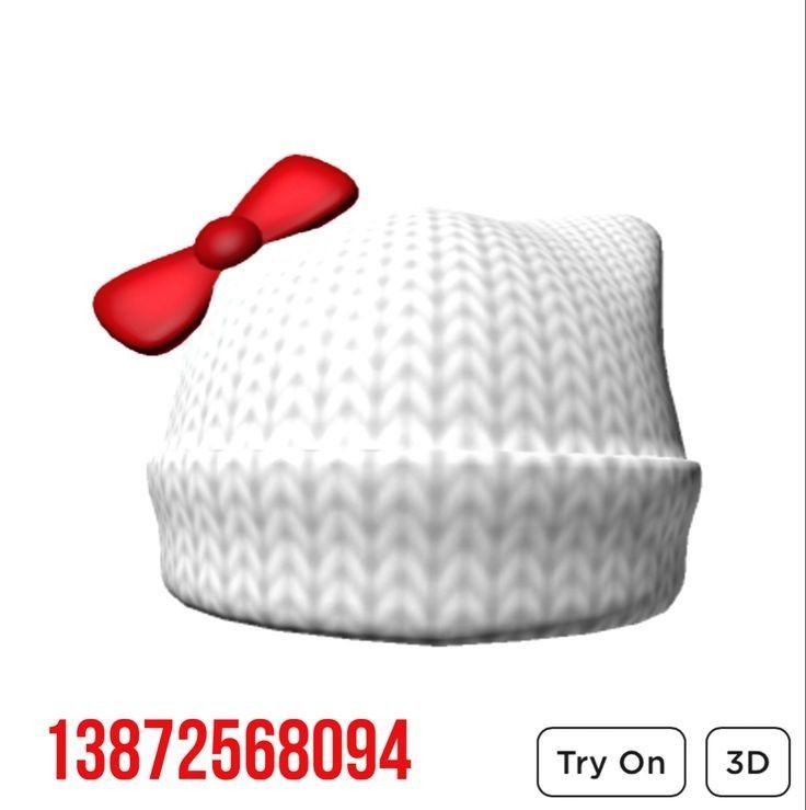 a white hat with a red bow on the front and back of it's cap