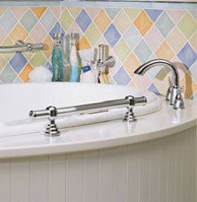 a bathtub with two faucets and soap dispensers on it