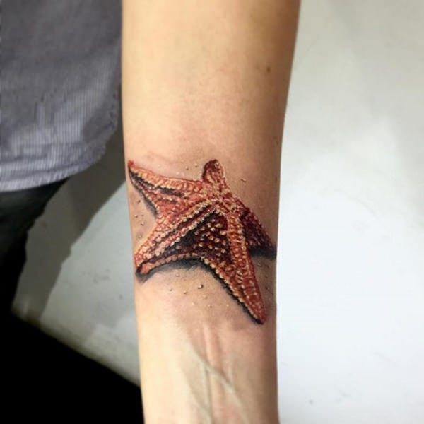 a person with a starfish tattoo on their arm