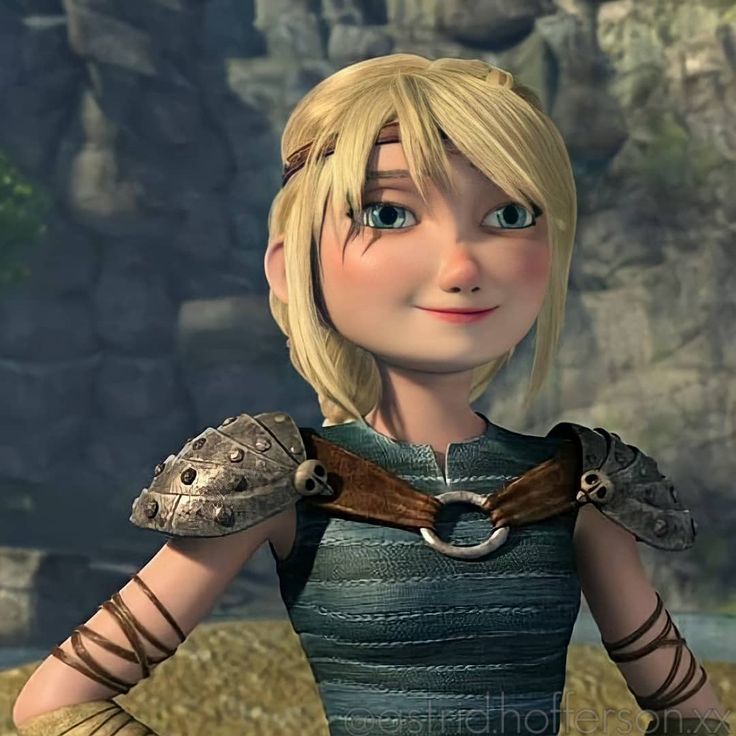 a cartoon character with blonde hair and blue eyes wearing armor, looking at the camera