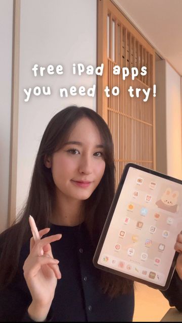 a woman holding up an ipad with the caption free ipad apps you need to try