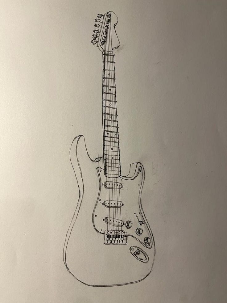 a drawing of an electric guitar on a sheet of paper with pen and ink in it