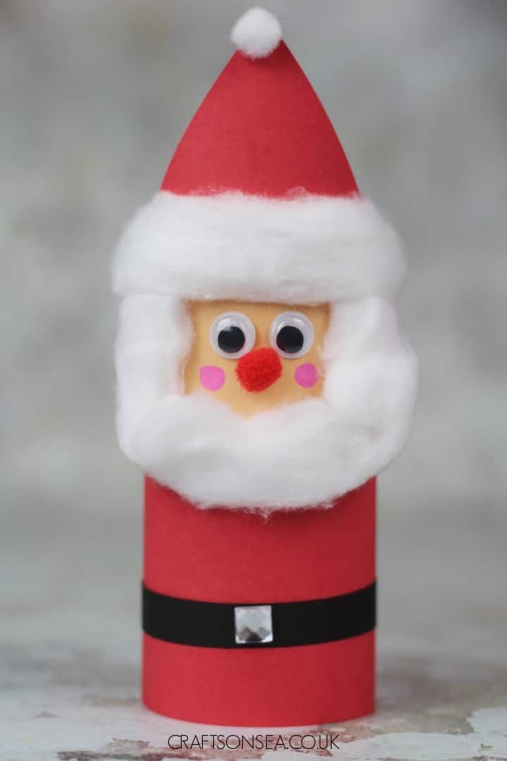 an image of a santa clause made out of toilet paper with eyes and nose on it