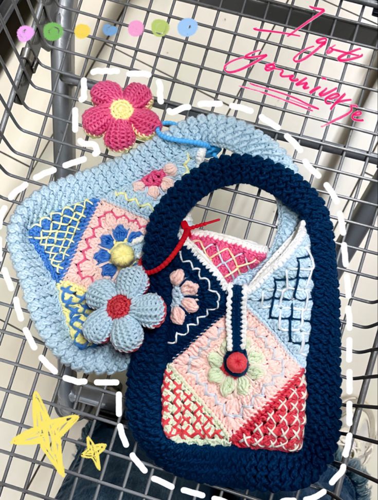 two purses sitting on top of a shopping cart