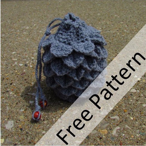 a ball of yarn sitting on the ground next to a tag that says free pattern