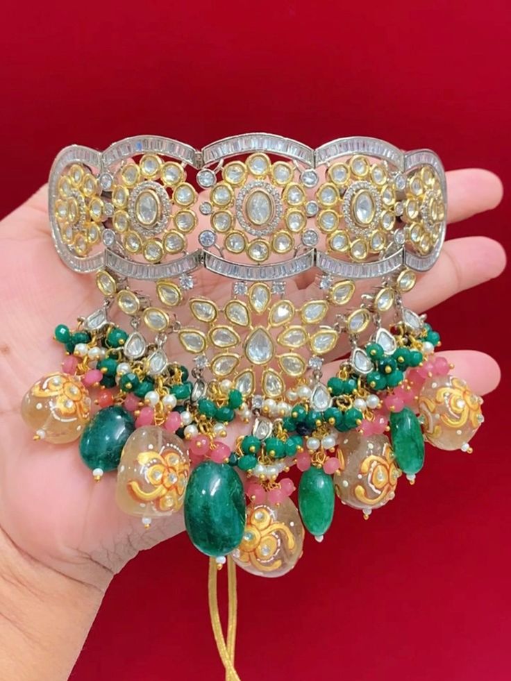 Premium quality Designer piece. American diamond lining . Uncut foil kundan, crystal beads, tumble beads . Glass quartz band work. widest part of the choker is about 2 inch. Beaded part sits in the neck in V shape. Comes with matching kundan earring . Oversize about 5.5 inch long . Light weight , push back . Party Kundan Choker With Tilla Details, Party Kundan Choker With Cutdana, Beaded Kundan Choker For Party, Kundan Beaded Choker For Parties, Beaded Kundan Choker Necklace For Party, Kundan Choker For Festivals And Parties, Party Beaded Kundan Choker Necklace, Bollywood Style Kundan Beaded Choker, Bollywood Style Heavy Choker For Party