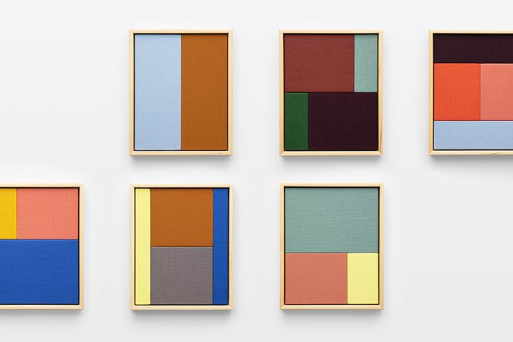 four square paintings are arranged in different colors