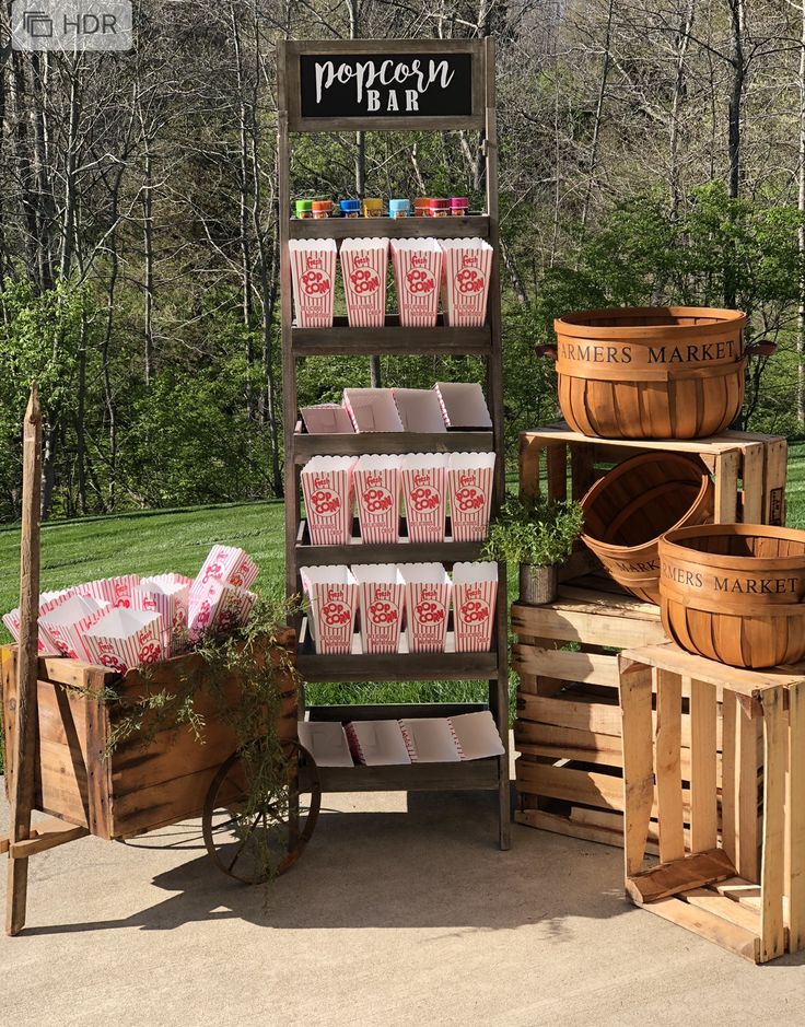 an outdoor market with wooden crates and baskets