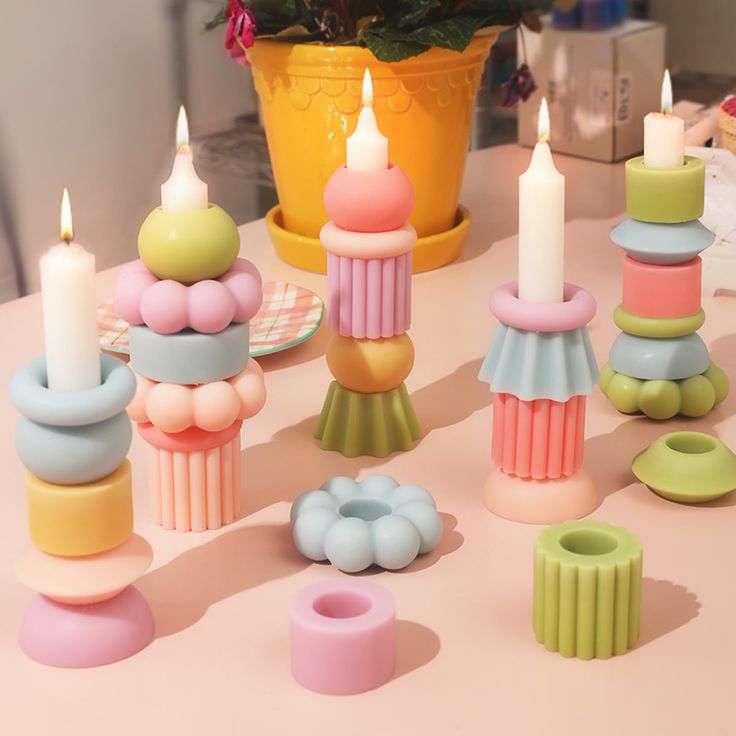 there are many small candles on the table