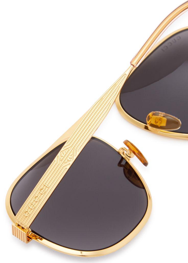 Long Description#Info & Care# Gucci metal sunglasses Designer-engraved lenses, textured frame trim and arms, logo embossed arms 100% UV protection  Presented in a velvet hard case with a cleaning cloth  #Size & Fit# Frame width: 14cm  Frame height: 5.5cm Textured Frame, Aviator Style, Metal Sunglasses, Gold Sunglasses, Sunglasses & Glasses, Designer Sunglasses, Hard Case, Cleaning Cloth, Uv Protection