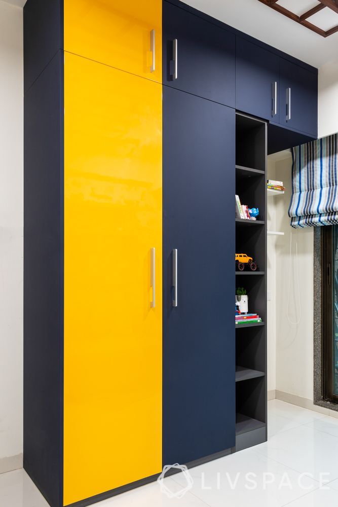 a yellow and blue cabinet in the middle of a room