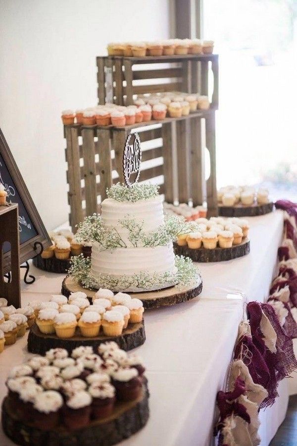 a table topped with lots of cakes and cupcakes on top of it's sides