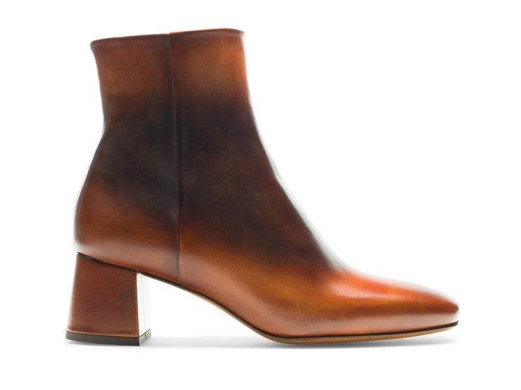 The Arlyne is a sleek mid-calf ankle boot featuring a mid-heel at a flattering height. The sleek and minimal silhouette displays a beautiful hand painted patina transitioning from a light to dark hue. The Arlyne features a side zipper closure ease of entry. Elegant Cognac Boots With Almond Toe, Elegant Cognac Heeled Boots For Formal Occasions, Elegant Cognac Boots For Formal Occasions, Elegant Formal Cognac Boots, Classic Cognac Heeled Boots For Formal Events, Classic Cognac Heeled Boots For Formal Occasions, Cognac Heeled Boots For Formal Fall Occasions, Elegant Cognac Boots For Fall, Formal Cognac Heeled Boots For Fall