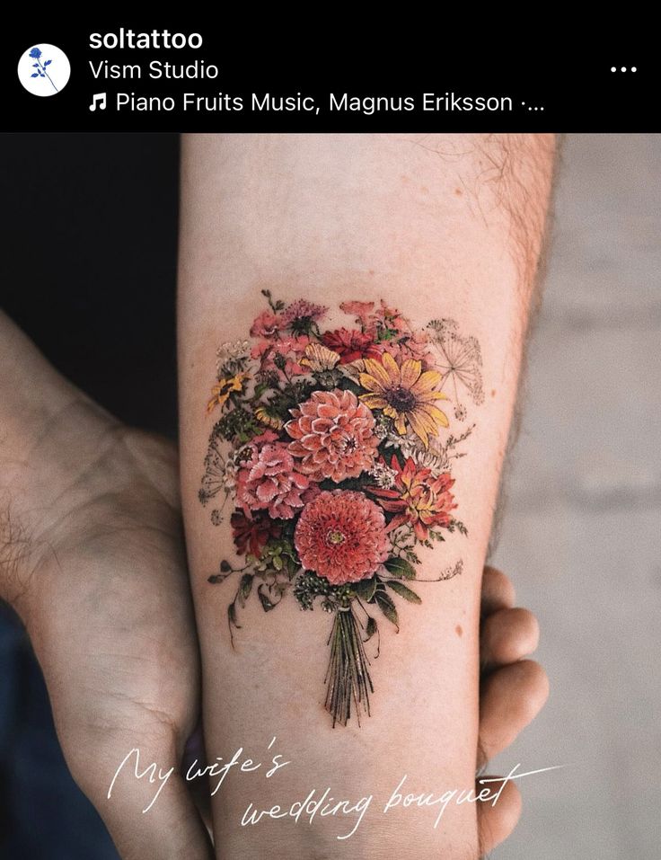 a woman's arm with flowers on it and the words, my wife's wedding bouquet