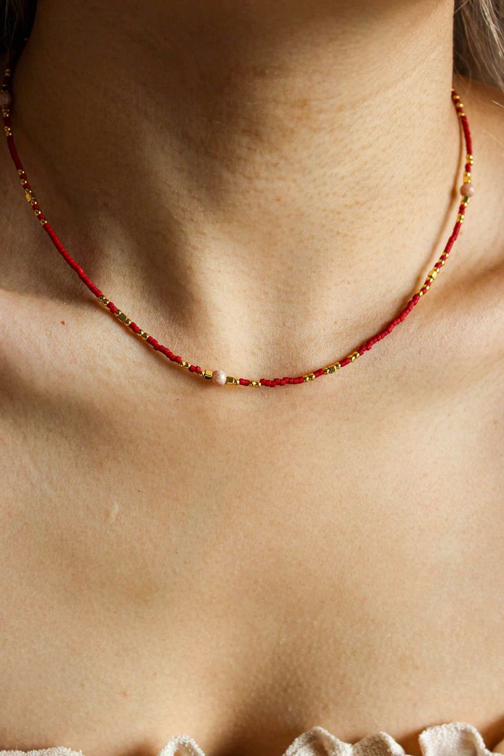 PRODUCT DESCRIPTION Elegance meets the holiday spirit in our Scarlet Necklace. Crafted with natural Garnet and glass beads, this necklace exudes a warm, vibrant charm that's perfect for the festive season. Natural Gemstone Necklace Water Resistant 18k Gold-plated on High-quality brass Natural Garnet and glass beads Length: 40cm plus 5cm adjustable chain Read our full Jewellery Care Guide here Read our Sizing Guide here Adjustable Charm Bracelet For Festivals, Festive Adjustable Round Bead Necklace, Adjustable Festive Necklace With Round Beads, Bohemian Beaded Jewelry For Holidays, Bohemian Beaded Holiday Jewelry, Elegant Beaded Necklace For Holiday, Holiday Bohemian Beaded Jewelry, Gold Beaded Necklace For Christmas, Festive Necklaces With Tiny Round Beads