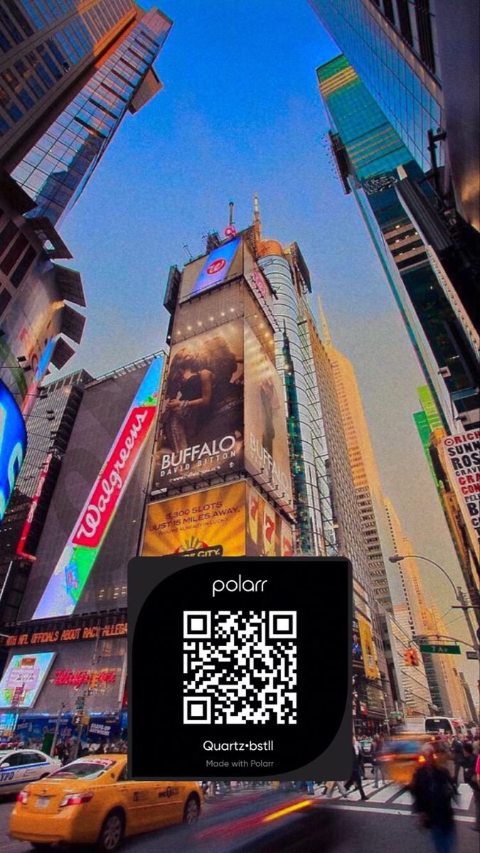 a city street filled with tall buildings covered in billboards and traffic lights, as well as a qr code