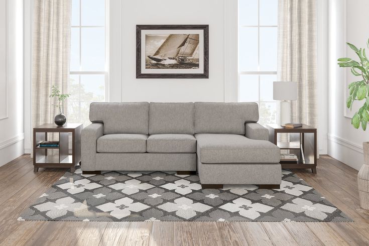 a living room scene with focus on the sectional sofa and chair, along with an area rug