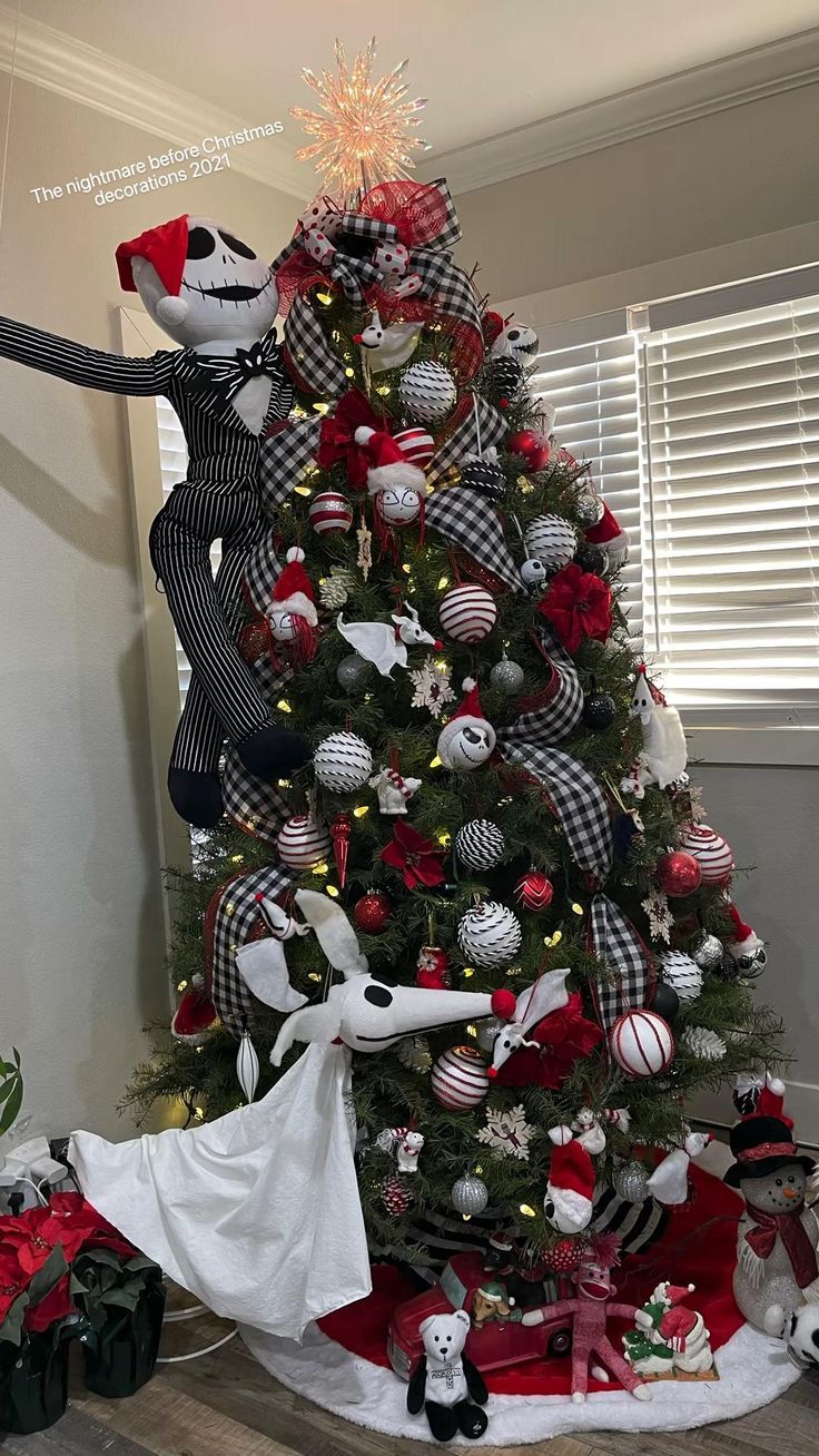 a christmas tree decorated with red, white and black ornaments