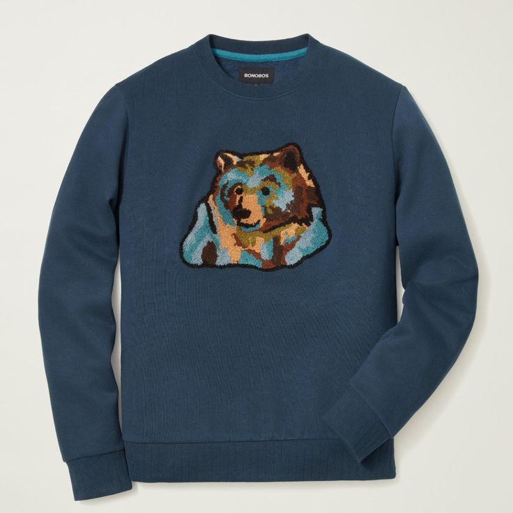 Super Soft Fleece With Novelty Rib And Original Artwork (Chenille Embroidery) Blue Fleece Tops With Embroidered Logo, Blue Crew Sweatshirt With Embroidered Graphics, Blue Fleece Sweatshirt With Graphic Print, Blue Winter Sweatshirt With Embroidered Logo, Winter Blue Sweatshirt With Embroidered Logo, Blue Relaxed Fit Sweatshirt With Embroidered Graphics, Blue Crew Sweater With Embroidered Graphics, Blue Crew Neck Sweater With Embroidered Graphics, Blue Relaxed Fit Fleece Sweater