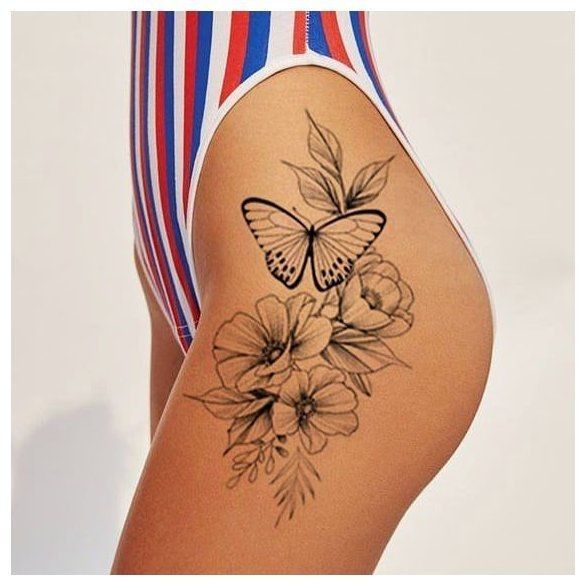 a woman with a butterfly tattoo on her lower back and side view of her body