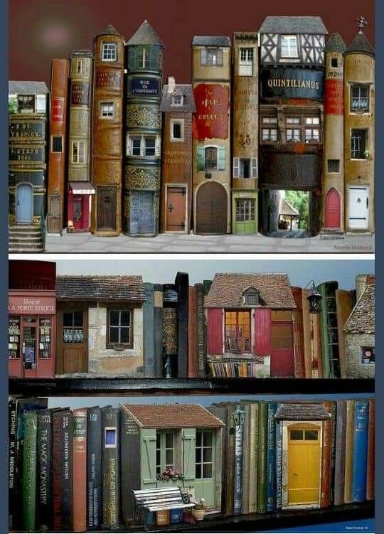 there are many books stacked on top of each other in front of the same building