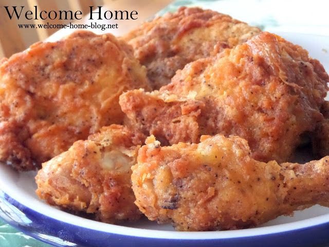 some fried food is sitting on a blue and white plate with the words welcome home