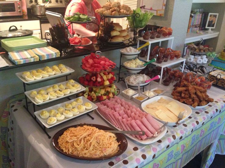 a buffet table filled with lots of food