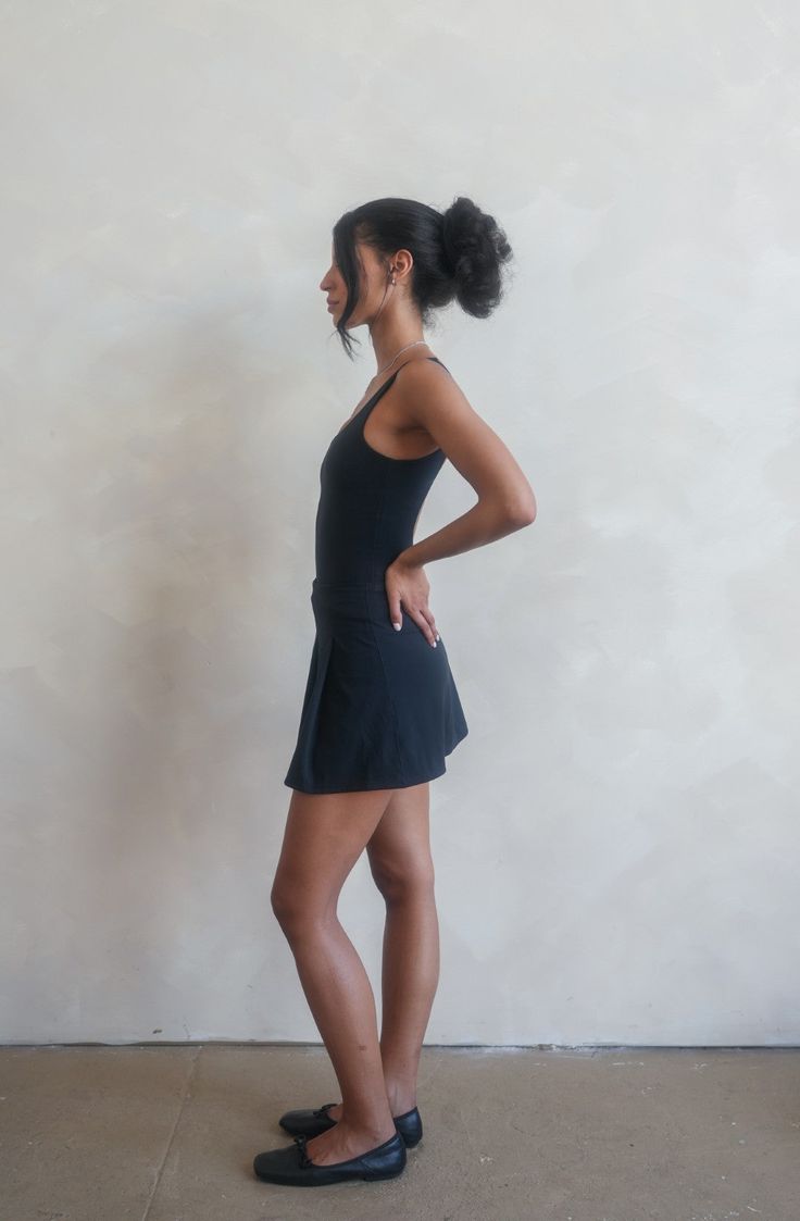 With a sophisticated pleated design in the front and a sleek plain back, this skirt embodies both grace and versatility. Whether you're on the tennis court, at the gym, or in a barre class, this skirt is your perfect companion, offering freedom of movement with its inbuilt shorts. Made from our exclusive 'Marby a day' fabric, this skirt ensures comfort and breathability throughout your day. Its transitional nature allows you to effortlessly shift from athletic activities to social gatherings. Si Fitted Athleisure Swim Skirt, Fitted Sporty Swim Skirt, Fitted Athleisure Tennis Bottoms, Black Athleisure Skirt For Summer, Sporty Gym Skirt For Summer, Fitted Lined Tennis Skirt, Fitted Lined Swim Skirt For Sports, Short Lined Tennis Skirt For Sports, Fitted Skirted Swim Skirt For Sports