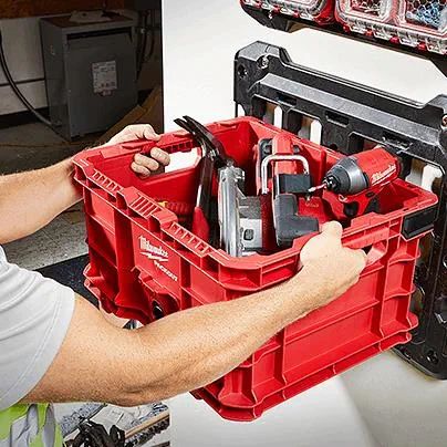 a man is working on a tool rack