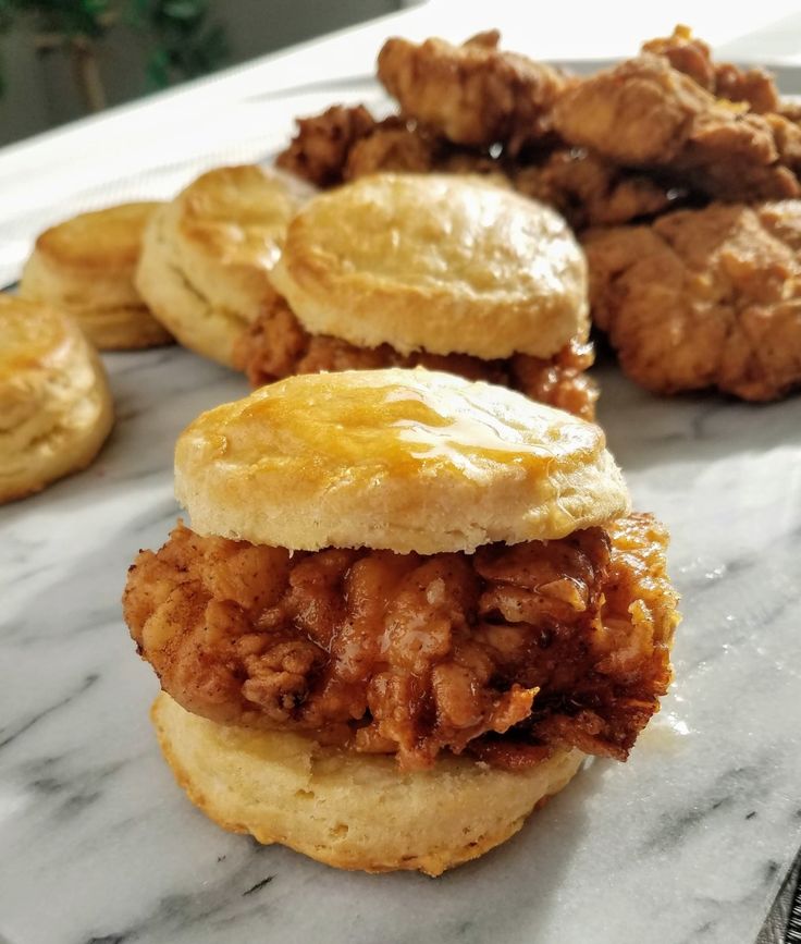 fried chicken and biscuits on a marble counter top