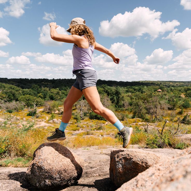 Designed for year-round activities, the Active Light shorts are made with lightweight, quick-drying fabric and have a built-in liner. Whether you're hiking, hitting the gym, or going for a ride, these shorts are designed for action. Dani is 5'10 jumping rocks wearing a Medium Gray Sasha is 5'6 wearing a Medium Gray Camille is 5'4 climbing boulders in a Small Pink Amanda is 5'7 wearing a Medium Pink Epic Story, Great Stories, Hoodie Top, Bouldering, Short Pants, Tank Shirt, Tank Top Shirt, Womens Shorts, Sweatshirts Hoodie