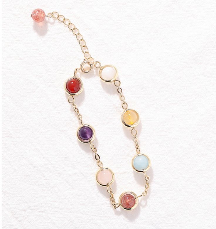 This exquisite multicolor stone bracelet is crafted from a combination of the finest materials and with the utmost care. The vibrant colors give it a luxurious and sophisticated feel, ensuring it will be a striking addition to any outfit. Perfect for adding a touch of glamour to special occasions. Multicolor Crystal Jewelry With Stones, Elegant Crystal Bracelet With Colorful Beads, Gold Crystal Bracelets With Colorful Beads, Gemstone Metal Bracelets For Gifts, Metal Gemstone Bracelets For Gifts, Metal Gemstone Bracelets As Gift, Multicolor Jewel Bracelets For Party, Multicolor Beaded Crystal Bracelet, Elegant Gold Charm Bracelet With Colorful Beads