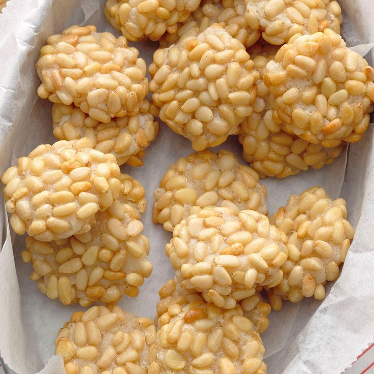 there are many cookies in the basket on the table and one is filled with nuts