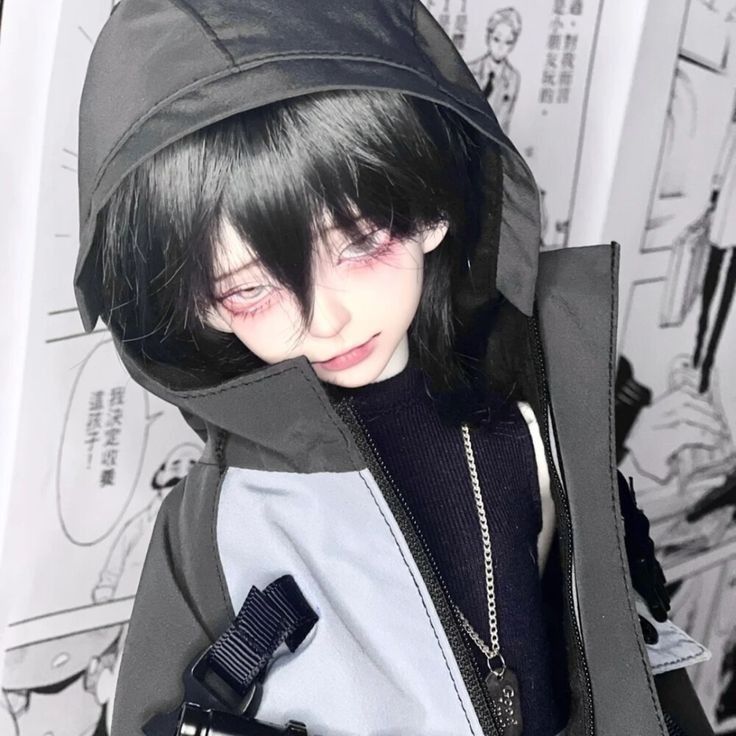 a doll with black hair wearing a hoodie