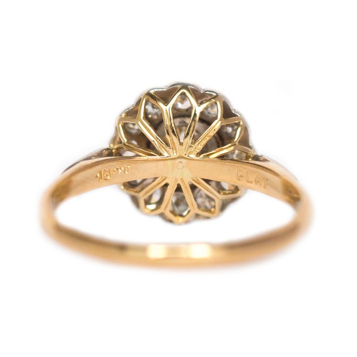 * VIEW A VIDEO OF THIS RING * https://youtu.be/bY0Fhm3gsck Description: Here we have a gorgeous Edwardian Era 14 karat yellow gold ring with a platinum head. It is absolutely beautiful, featuring a GIA certified .55ct center stone. It has been well kept and well preserved throughout so many years. The floral setting featuring .15cttw diamonds around the center is what makes this ring so unique! We are amazed at the condition of the ring as well as it's unique design! This piece is accompanied wi Antique Yellow Gold Diamond Ring With Center Stone, Antique Yellow Gold Ring With Center Stone, Antique Yellow Gold Rings With Center Stone, Classic Yellow Gold Cluster Ring With Rose Cut Diamonds, Yellow Gold Halo Ring With Rose Cut Diamonds, Antique Brilliant Cut Yellow Gold Diamond Ring, Antique Yellow Gold Brilliant Cut Diamond Ring, Antique Brilliant Cut Diamond Ring In Yellow Gold, Classic Hallmarked Diamond Halo Ring