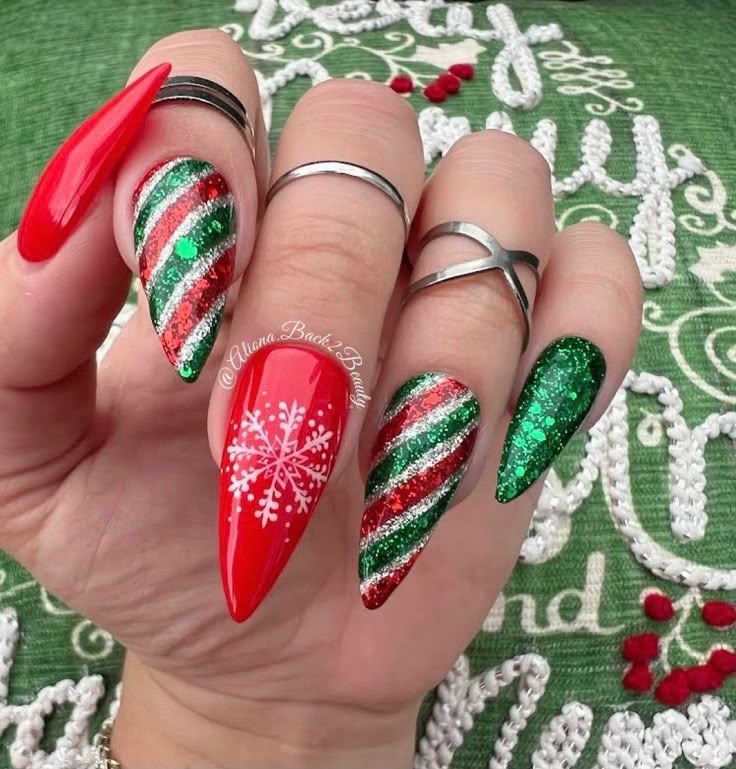 Handmade Red and Green Christmas Nails, Sparkling Winter Press on Nails, Reusable Glue on Nails, Candy Cane Nails, Snowflakes Nails Model: Medium Stiletto Please read full description below. This set features:  Handcrafted red and green winter nails Index & Ring - Glitter green red and silver candy cane design Middle - handpainted white snowflake on a red background Glossy finish Gel polish. I offer quality handcrafted press on nails designed with quality gel polish. This set will give you a per Red And Green Christmas Nails, Green Christmas Nails, Christmas Winter Nails, Nails Sparkling, Classy Acrylic, Candy Cane Nails, Christmas Nail Ideas, Red Christmas Nails, Red And Green Christmas