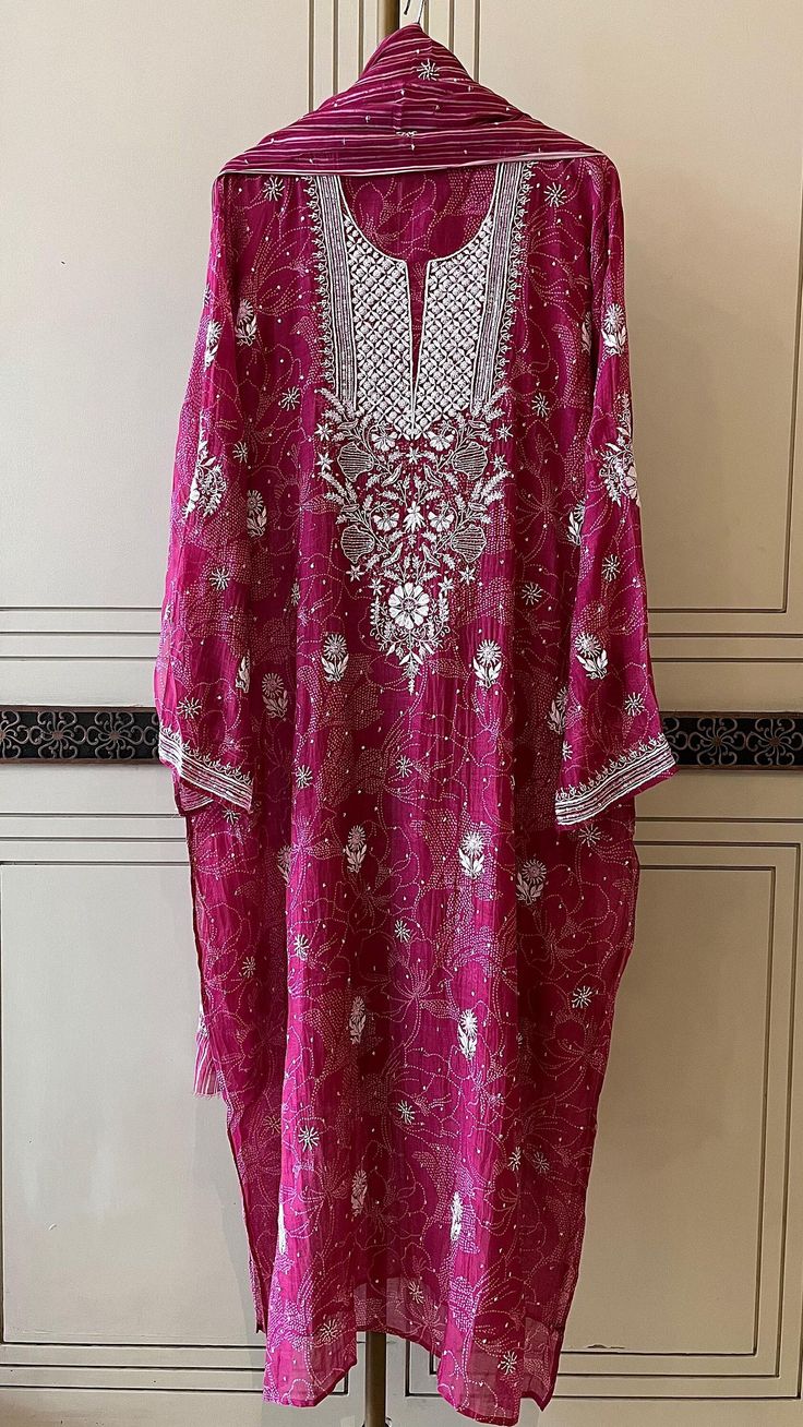 Discover the timeless charm of our Pure Cotton Silk Kurta Set, an epitome of elegance and grace. This luxurious ensemble features vintage chikankari embroidery, beautifully embellished with delicate pearls, cut dana, and shimmering sequins, creating a dazzling masterpiece that exudes sophistication. The kurta comes paired with a matching dupatta, seamlessly blending tradition with modern style. Lined for comfort, the set offers the flexibility of choosing between chic churidhaar or stylish pants as bottoms. Available for customization to any size, this kurta set promises a perfect fit. Kindly send your size specifications before placing your order to ensure a bespoke experience. Silk Kurta Set, Chikankari Embroidery, Silk Kurta, Stylish Pants, Kurta Set, Cotton Silk, Pure Cotton, Modern Style, Favorite Outfit