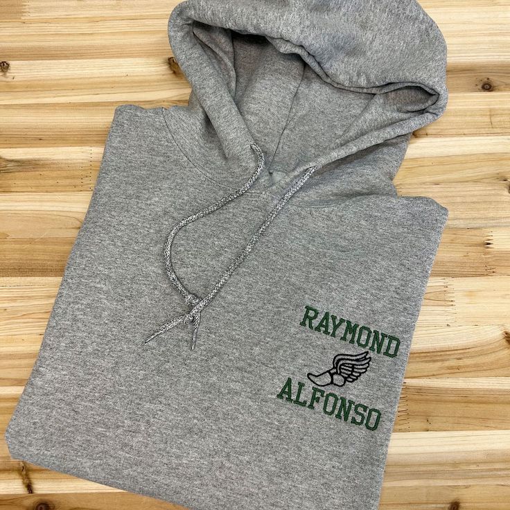 Way to go, Track and Field teams! We know how hard you work in your sport, so why not show the world that you’re proud of what you do with this awesome Track and Field Personalized Hooded Sweatshirt? It’s the perfect way to wear your team spirit wherever you go and makes a great gift for the end of the season. This super soft hoodie is made with quality materials to last a long time. Plus, it can be personalized with your team name and runners name embroidered on the front of the sweatshirt. Couple Items, Ffa, Team Name, Soft Hoodie, True Red, Way To Go, Team Names, Track And Field, Team Spirit