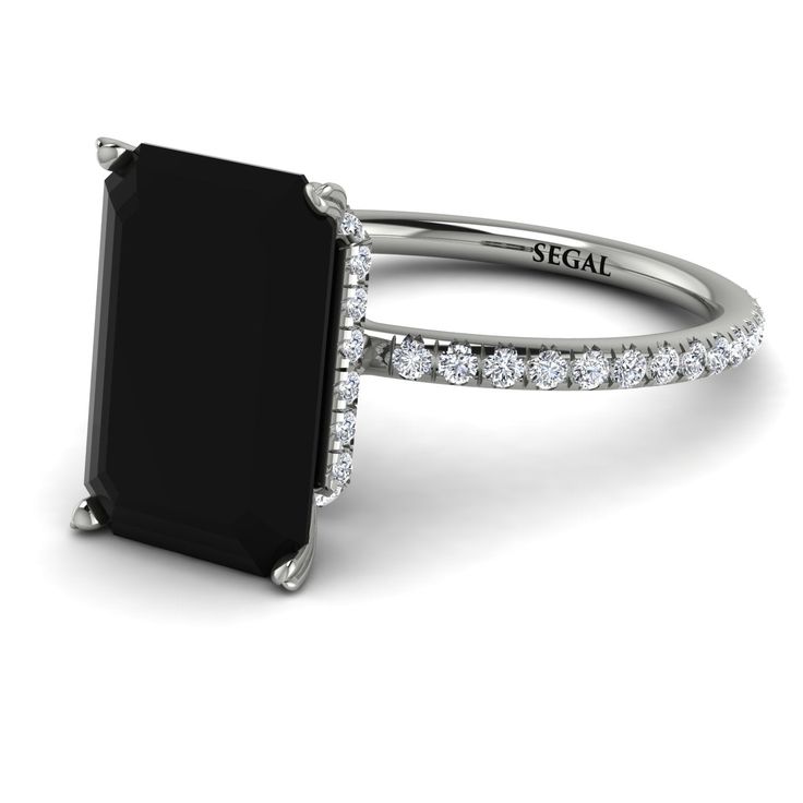 an engagement ring with black onyxite and diamonds