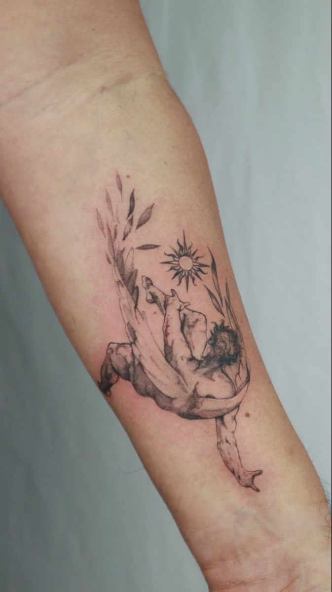 a woman's arm with a tattoo on it that has flowers in the middle