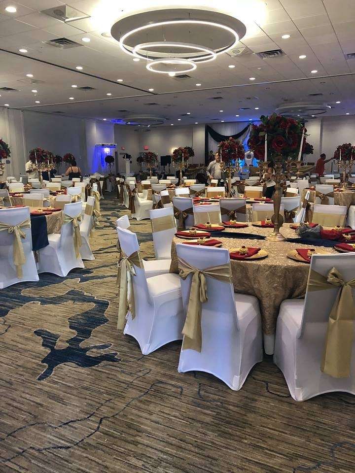 a banquet hall set up with tables and chairs