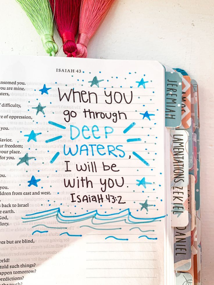 an open bible with the words when you go through deep waters, i will be with you