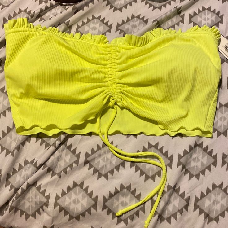 Neon Green-Yellow Swim Top. Bandeau Style. The Middle Does Have A Tie Away To Scrunch The Center Off The Top For Styling. Removable Padding. New With Tag, Never Worn. Pieces Sold Separately. Yellow Strapless Swimwear For Summer, Yellow Strapless Beach Top, Yellow Tops For Poolside Spring Season, Strapless Yellow Beach Top, Neon Yellow Stretch Sleeveless Swimwear, Yellow Bandeau Top For Beach, Neon Yellow Beach Tops For Spring, Yellow Stretch Strapless Top, Yellow Strapless Stretch Top