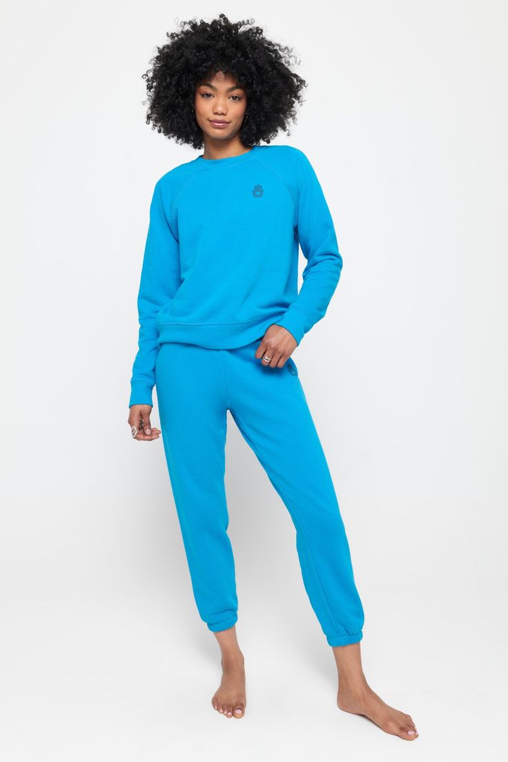 When your Crew Neck feels this good, you'll find any excuse to throw it on. Meet the Hamsa Forever Crew, a relaxed-fit layer equally ready for post-workout or the main event. Softness like no other Classic crew neck and raglan sleeve Relaxed fit with room to move Elevated rib edge detail Puff printed Hamsa graphic | Hamsa Forever Crew in Azul Comfy Activewear With Ribbed Cuffs For Workout, Comfy Relaxed Fit Sweatshirt For Workout, Comfy Sweatshirt With Relaxed Fit For Workout, Relaxed Fit Sportswear Sweatshirt For Workout, Comfy Relaxed Fit Tops For Sports, Relaxed Fit Functional Tops For Loungewear, Blue Athleisure Sweats With Ribbed Waistband, Athleisure Sweats With Ribbed Cuffs For Sports, Casual Sweat Resistant Sweatshirt For Gym