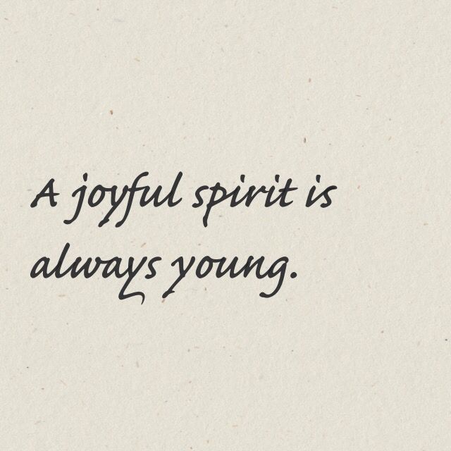 a handwritten quote on white paper with black ink that reads, a joyful spirit is always young