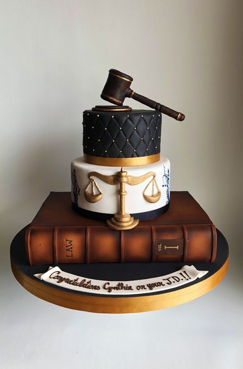 a cake made to look like a book with a judge's hammer on top