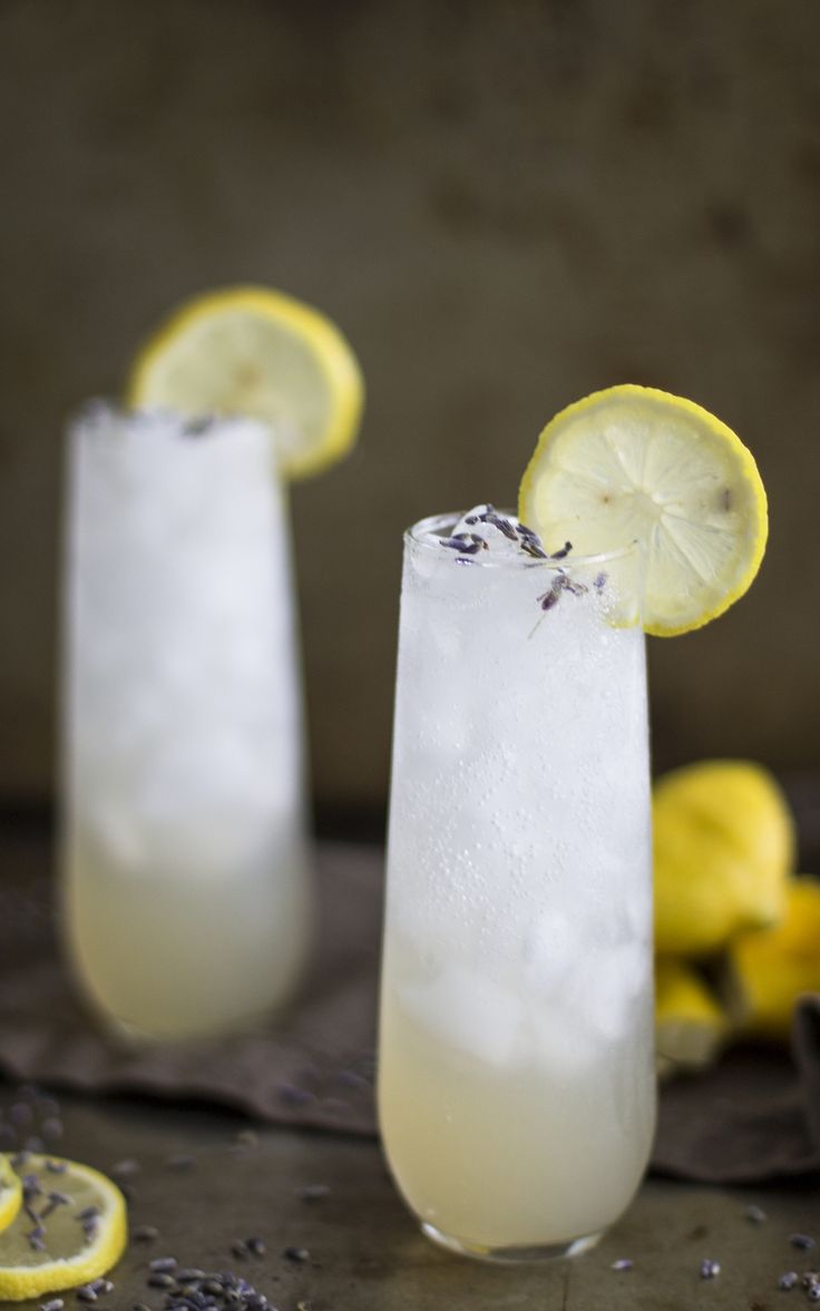 two glasses filled with ice and lemon slices