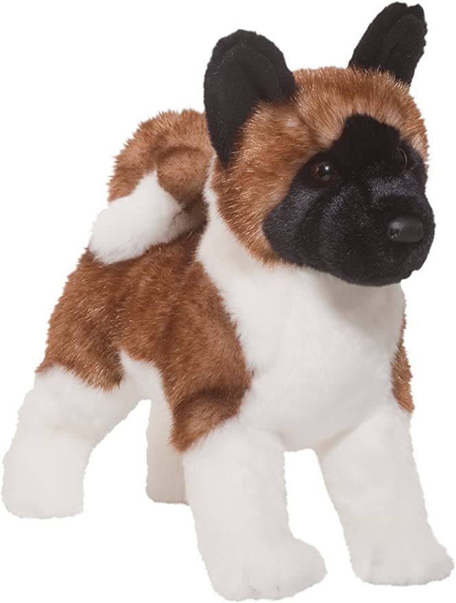 a brown and white dog stuffed animal on a white background