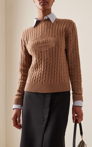 Find PRADA Logo-knit Cashmere Sweater It 40 on Editorialist. Founded in 1913 in Milan by Mario Prada; today the house looks to the archives to craft exceptional wardrobe essentials that are timeless and built to last.This crewneck sweater has a classic fit meticulously crafted in Italy from cable-knit cashmere that's soft and strong. The neutral camel shade pairs with everything. White Cashmere Sweater, Latest Sweater, Prada Logo, Logo Knit, Embroidered Wool, Women Essentials, Knitting Women Sweater, Cashmere Sweater, Crewneck Sweater